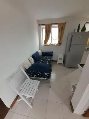 a living room with a couch and a table at Los gigantes posada in Villa Carlos Paz