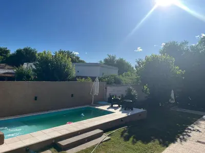 a swimming pool in the backyard of a house at Sin nombre in Mina Clavero