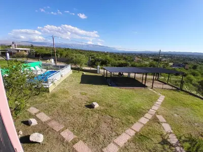 a view of a yard with a pool and a pavilion at Complejo Las Liebres in San Lorenzo