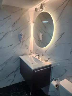 a bathroom with a sink and a mirror at Hotel El Paraiso Boutique in Villa Carlos Paz
