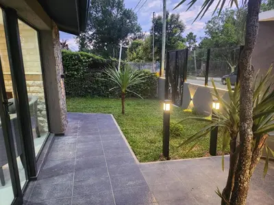 a walkway outside of a house with lights on it at Hotel El Paraiso Boutique in Villa Carlos Paz