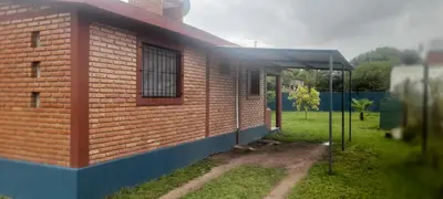 a brick building with a window on the side of it at Las Lomitas in Villa Cura Brochero