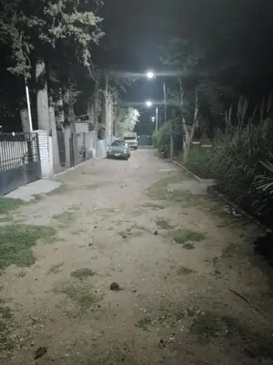 a car parked on a street at night at Alquiler Temporario a una cuadra del reloj cucu in Villa Carlos Paz