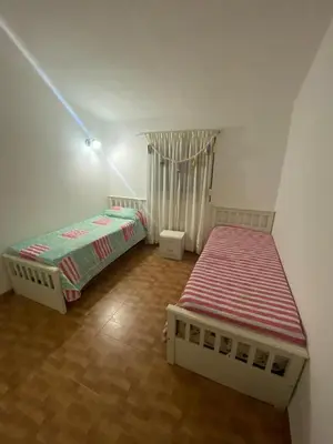 a bedroom with two beds in a room at Casa para 9 personas en Villa Carlos Paz in Villa Carlos Paz
