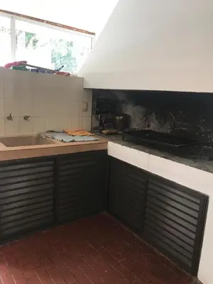 a kitchen with a sink and a counter top at Casa para 9 personas en Villa Carlos Paz in Villa Carlos Paz