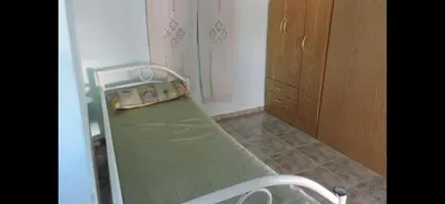 a small hospital bed in a room at Casa para 9 personas en Villa Carlos Paz in Villa Carlos Paz