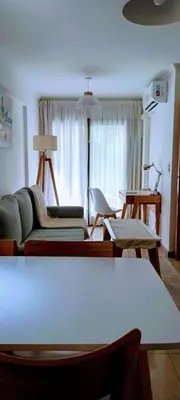 a living room with a couch and a table at Nórdico Nueva Córdoba in Cordoba