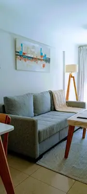 a living room with a couch and a table at Nórdico Nueva Córdoba in Cordoba