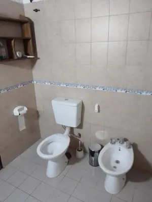 a bathroom with a toilet and a bidet at Casa D&M in Mina Clavero
