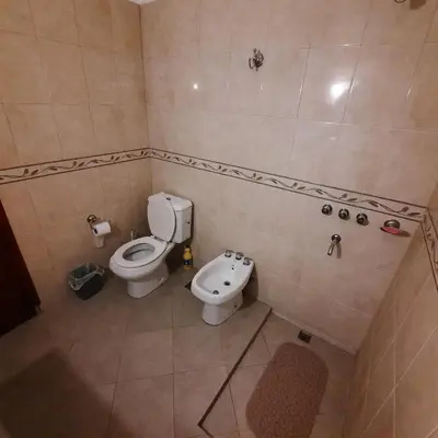 a small bathroom with a toilet and a sink at La Jose in Santa María