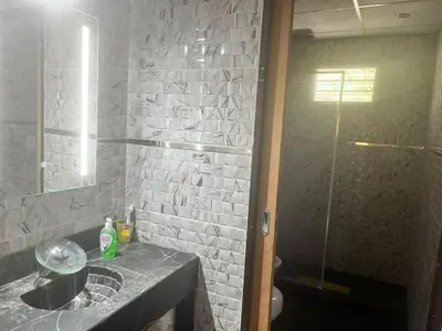 a bathroom with a sink and a shower at Adonay VGB in Villa General Belgrano