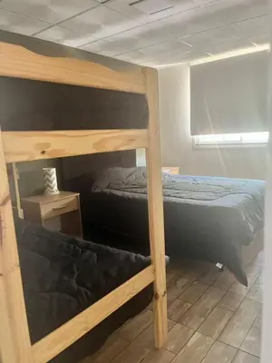 a bedroom with two bunk beds in a room at Adonay VGB in Villa General Belgrano