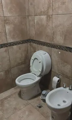 a bathroom with a toilet and a sink at depto en edificio miralejos 8 in Cordoba