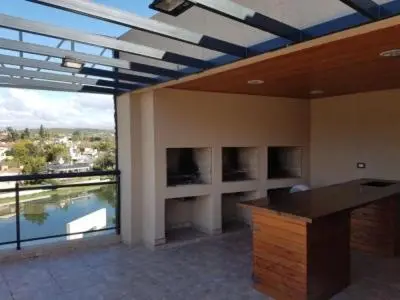 a large room with a large window and a desk at depto en edificio miralejos 8 in Cordoba