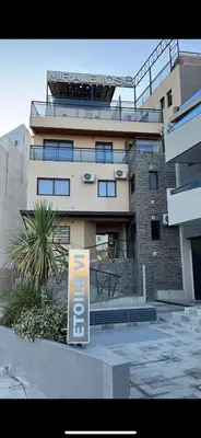 a large building with a sign in front of it at depto en edificio miralejos 8 in Cordoba