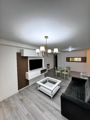 a living room with a couch and a table at Alquiler de 2 dorm en el corazón de Nueva Córdoba in Cordoba