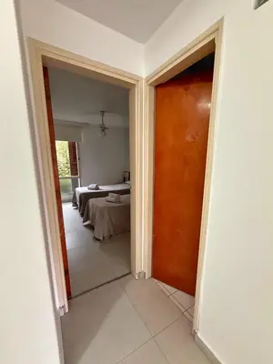 an open door to a room with a bed at Hotel Montecarlo PSH in Villa Carlos Paz