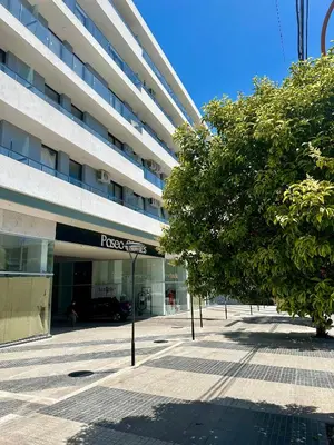 a parking lot in front of a building at Depa a Estrenar en el Centro, Pile, Aire Ac in Villa Carlos Paz