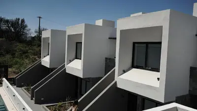 a building with balconies on the side of it at Departamento en Villa Carlos paz in Villa Carlos Paz
