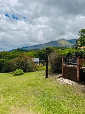 a view of a yard with mountains in the background at Merlinda in Merlo