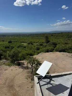 a white sign sitting on top of a hill at Escapada romántica en El Leon in San Javier