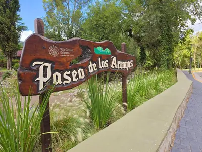 a sign that says paso the us armies in a park at FlussHaus3 in Villa General Belgrano