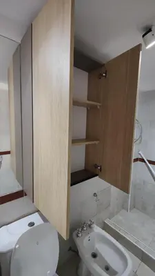 a bathroom with a toilet and a sink at Departamento de lujo en Nueva Cordoba in Cordoba