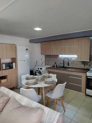 a kitchen and dining room with a table and chairs at Departamento de lujo en Nueva Cordoba in Cordoba