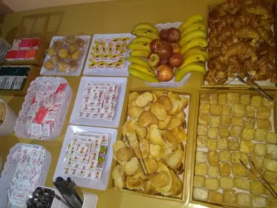 a table topped with lots of different types of food at Hotel Nuevo Fatica in Villa Carlos Paz