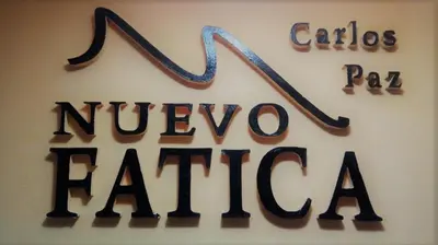 a sign for a nivevo faja sign on a wall at Hotel Nuevo Fatica in Villa Carlos Paz