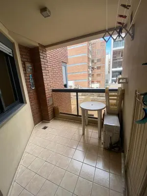 a small balcony with a table and a window at Depsal XVII 130 in Cordoba