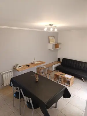 a living room with a black table and a couch at Departamento en general paz in Cordoba