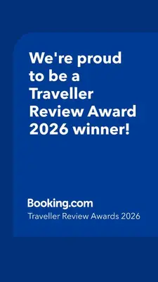 a blue sign that says were proud to be a traveller reviewagency winner at Abuela Betty in Villa Carlos Paz