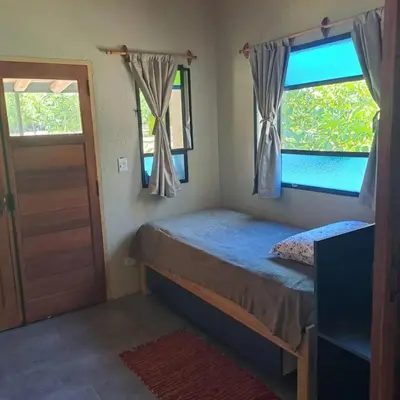 a small bedroom with a bed and a window at la vinca serrana in San Javier