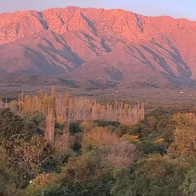 a view of a mountain range with trees in the foreground at la vinca serrana in San Javier
