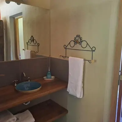 a bathroom with a sink and a mirror at la vinca serrana in San Javier