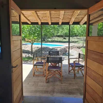 a screened in porch with a table and chairs at la vinca serrana in San Javier
