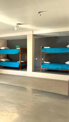 a room with blue bunk beds on the wall at La Fabrica in Yacanto