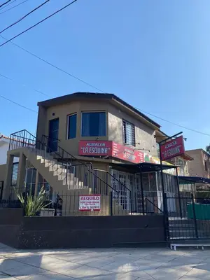a building with a staircase in front of it at Refugio Del Lago in Villa Carlos Paz