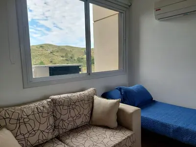 a living room with a couch and a window at Departamento en Potrero de Garay in Potrero de Garay