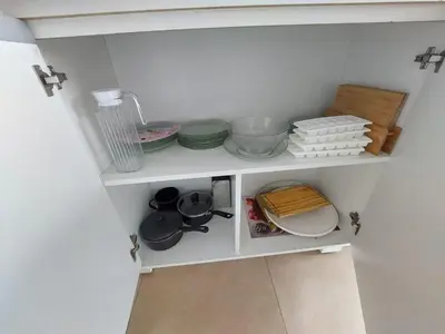 a cupboard with dishes and other kitchen items on it at Departamento en Potrero de Garay in Potrero de Garay