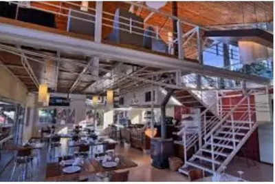 a large room with a staircase in a building at Departamento en Potrero de Garay in Potrero de Garay