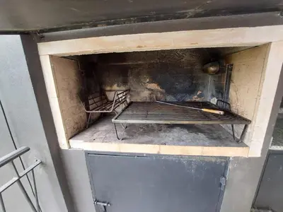 a brick oven with a bench inside of it at Departamento en Potrero de Garay in Potrero de Garay