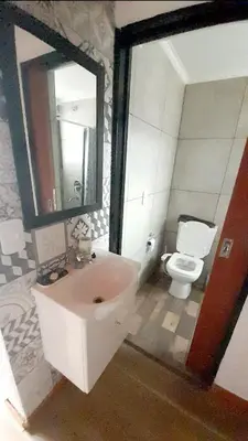 a bathroom with a sink and a toilet at Eco Aldea in Villa Ciudad Parque