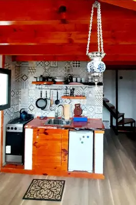 a kitchen with a sink and a stove at Eco Aldea in Villa Ciudad Parque