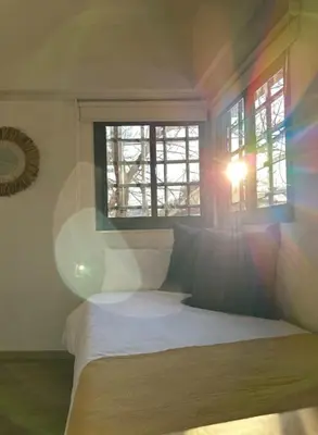 a bedroom with a bed and a window at Casa Spilimbergo in Cordoba