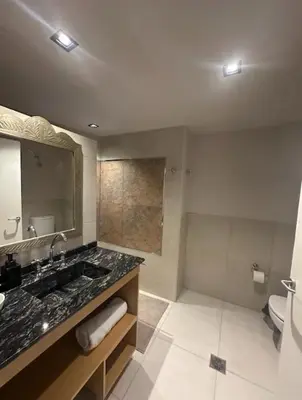 a bathroom with a sink and a toilet and a mirror at Casa Spilimbergo in Cordoba
