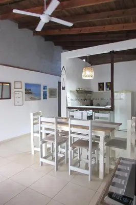 a dining room with a table and chairs at Casa Marie in Villa del Dique