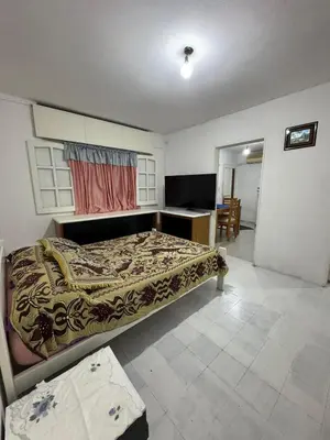 a bedroom with a bed and a desk at Departamentos Las Termas de Brochero in Villa Cura Brochero