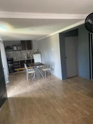 a kitchen and dining room with a table and chairs at Lo de joel in Villa Carlos Paz